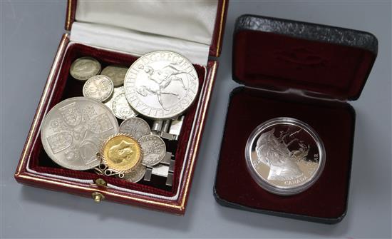 A mounted half sovereign, silver dollar (Canadian) etc.